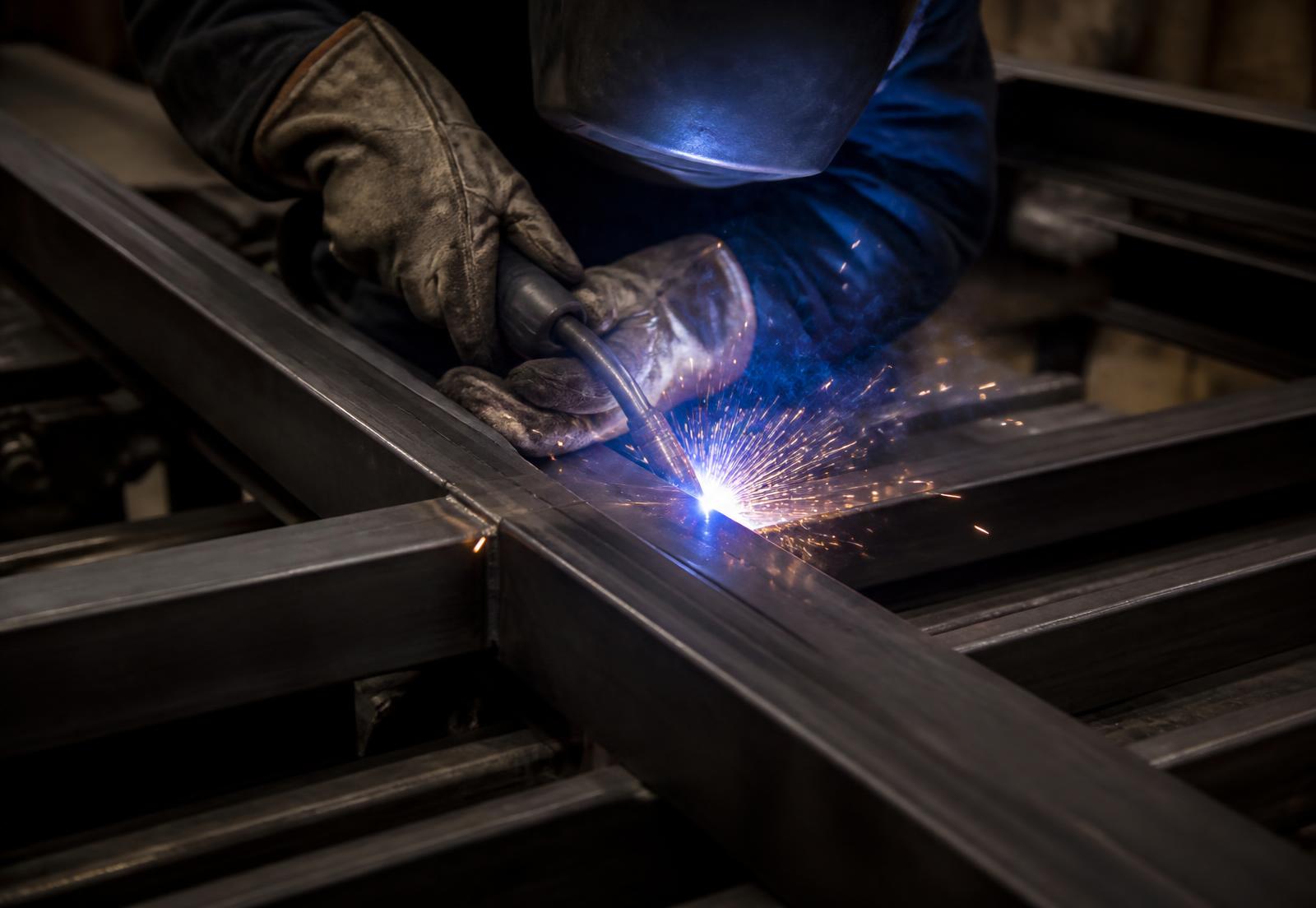 Welding a heavy steel gate frame in the shop